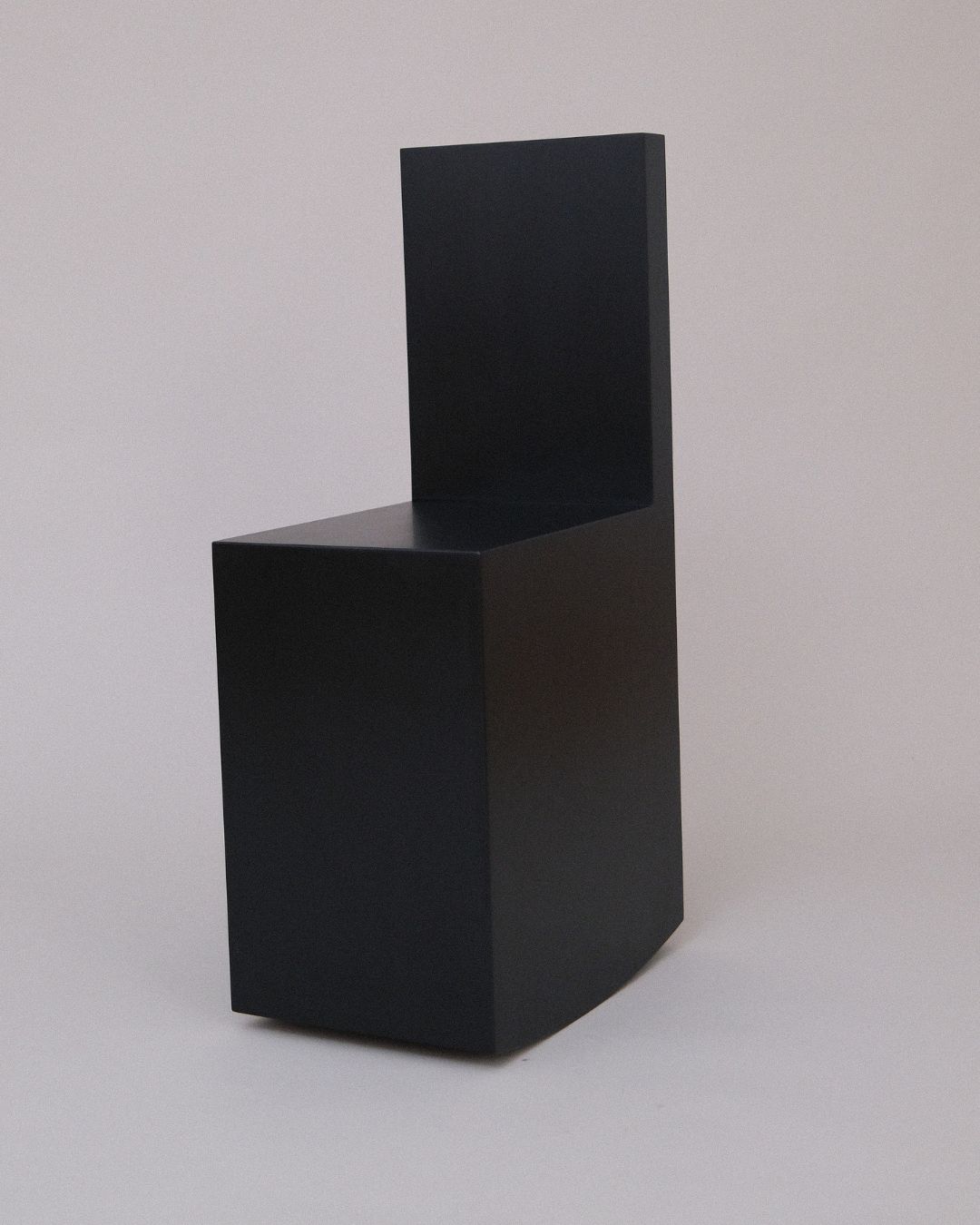 Close view of the Art Rocker by Studio Goons in black satin